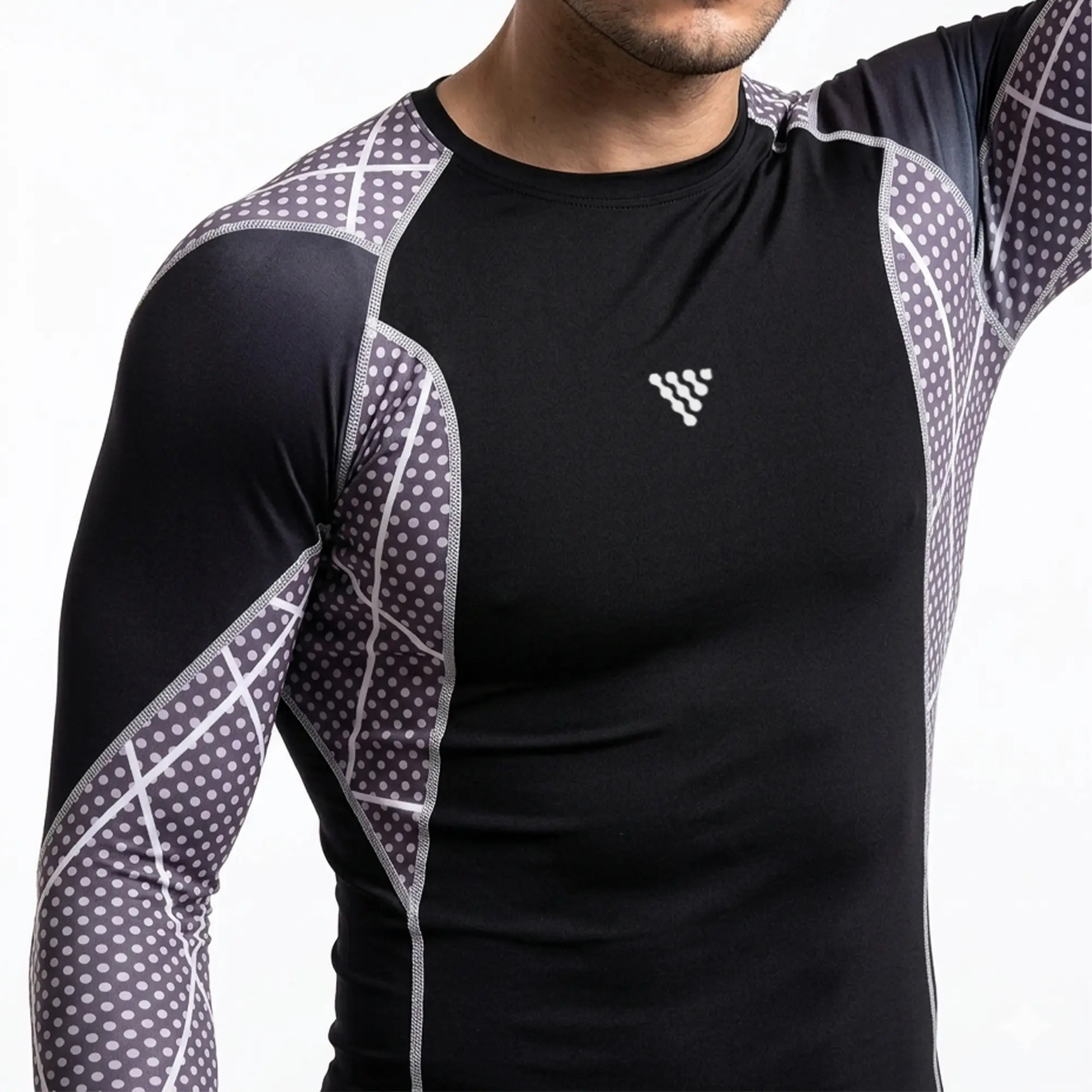 Close-up detail of men's athletic compression top featuring performance fabric and ergonomic panel construction.
