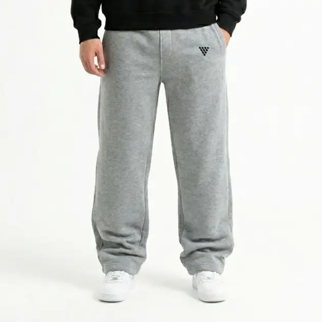 Men's grey baggy gym trousers worn with casual athletic outfit