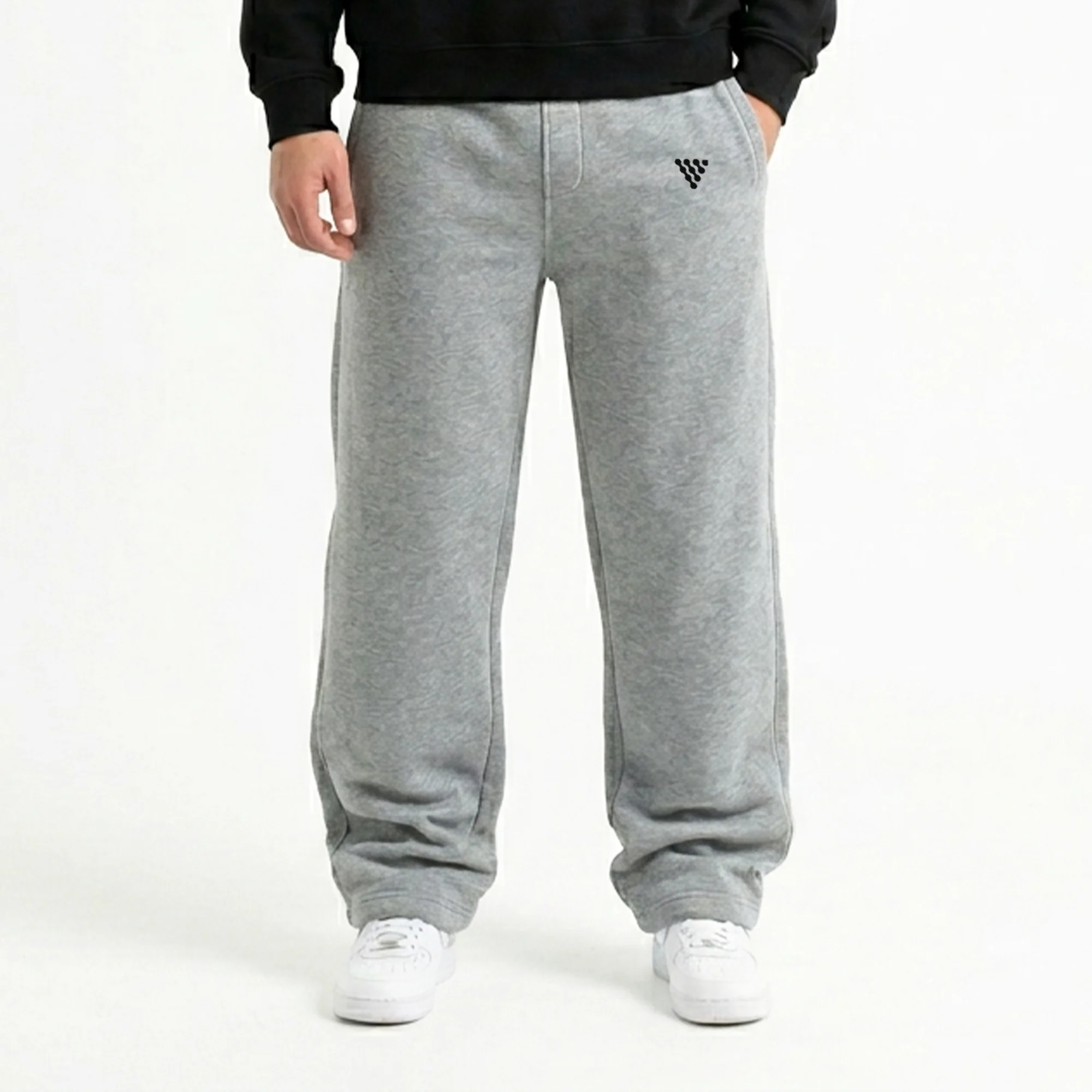 Men's grey baggy gym trousers worn with casual athletic outfit